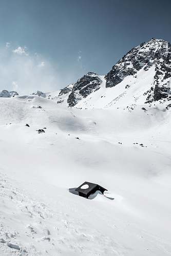 alps black house in middle of glacier mountain during daytime verbier