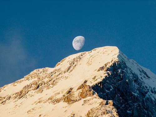 moon brown mountain under blue sky grindelwald