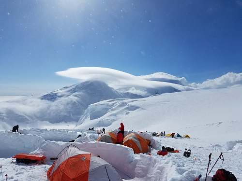 snow group of people camping on snow mountains tent