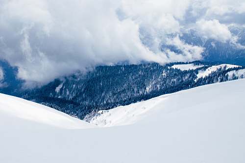 nature landscape photography of snow covered hill clouds