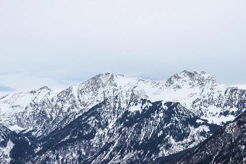 alps mountain covered by snow at daytime nature