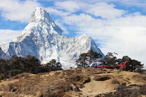peak white mountain peak near helecopter snow