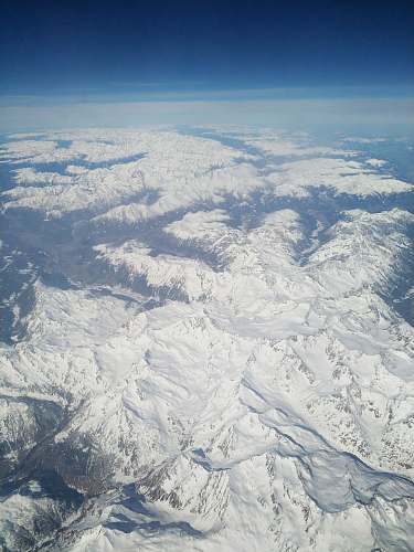 outdoors aerial view of snow covered mountain ranges scenery