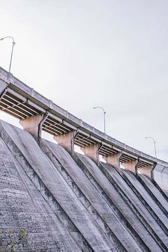outdoors brown concrete bridge river