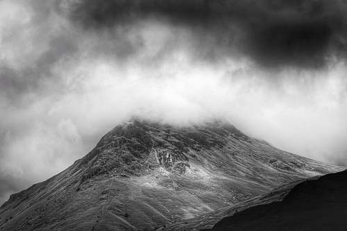 black-and-white grayscale photo of foggy mountain mountain