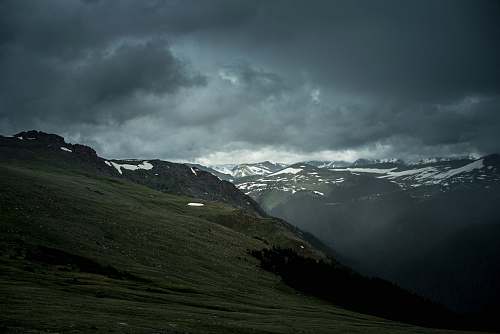 outdoors green mountain under cloudy sky mountain