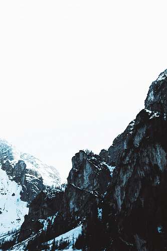 outdoors high-angle photography of rock mountains during winter mountain