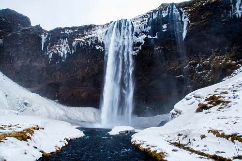 snow low-angle photography of waterfalls during winter ice
