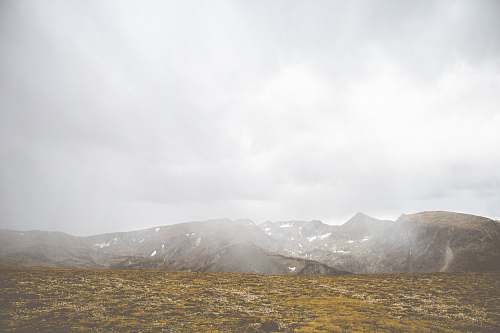 outdoors mountains and brown grass field plateau