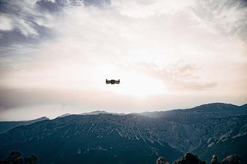 mountain quadcopter on sky mountain range