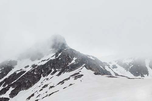 grey snow covered mountain top mountain