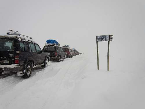 snow vehicle near sign outdoors