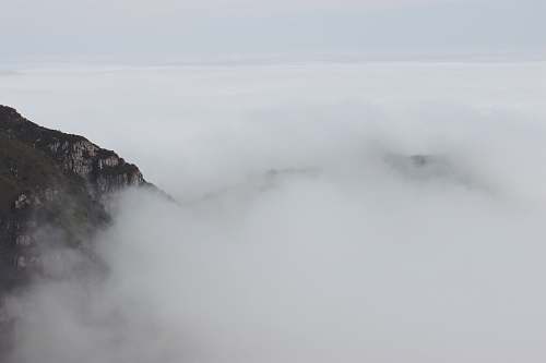 grey white cloud beside mountain fog