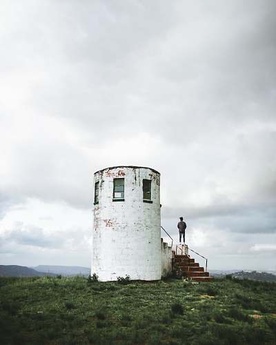 human white stone tower building person