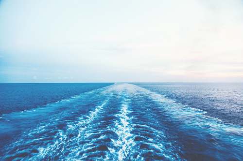water blue ocean water under white sky sea
