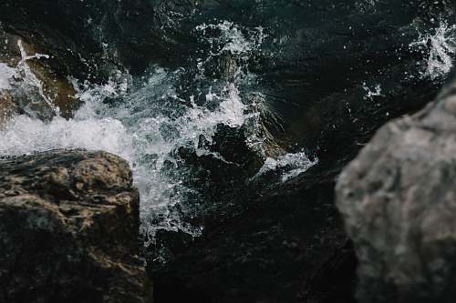 water sea waves crashing on rocks sea