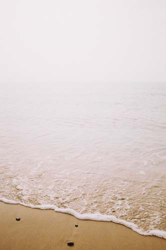 water seashore with gray stones sea