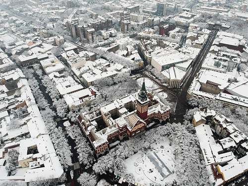 landscape aerial photography of snow covered city buildings nature