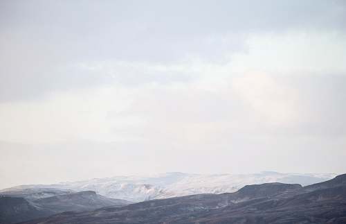mountain mountain view under white skies nature