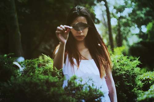 person woman holding green leaf human
