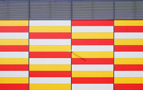 architecture white, red, and yellow striped bars background