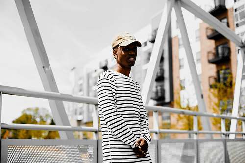 person man lean on bridge rail man