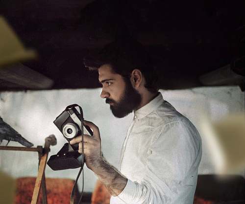 person person holding camera human