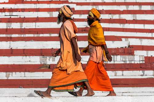 human two men walking on street person