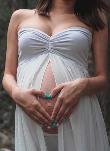 human woman holding her belly person