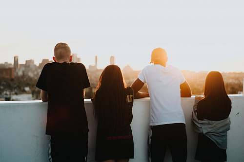 human four person looking at the city people