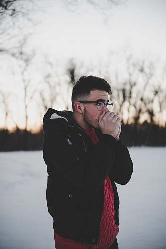 human man placing his hands on his mouth people