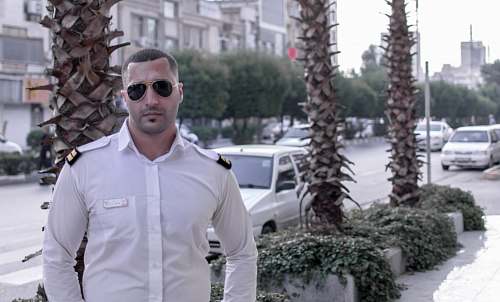 sunglasses man wearing uniform car
