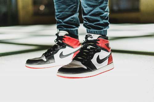 human person wearing black-white-and-red Air Jordan 1's people