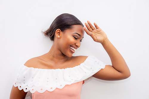 human smiling woman wearing white and pink off-shoulder dress female