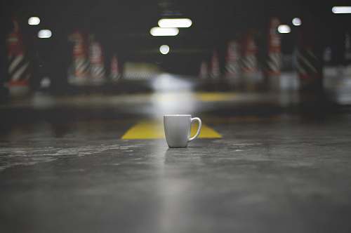 human white ceramic mug in middle cup