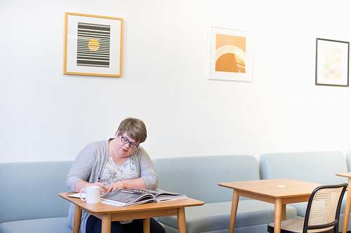 chair woman reading book furniture