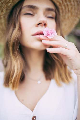 apparel woman smelling pink flower clothing