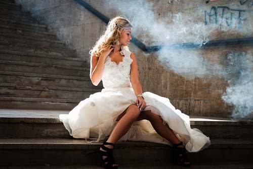people woman wearing white gown sitting on stir human
