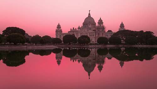 india white concrete castle near body of water dome