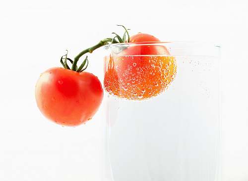 tomato tomatoes on clear drinking glass food