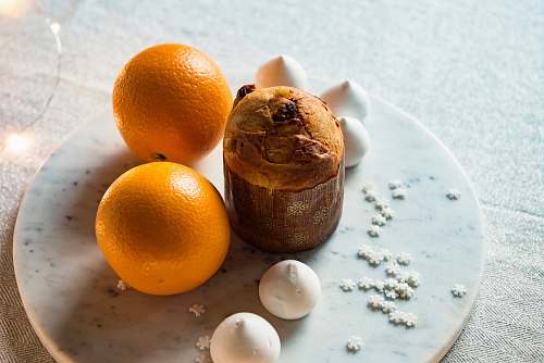 food two orange fruits on white plate orange