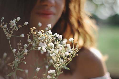 human woman holding flower person