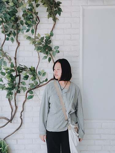 human woman standing near tree person