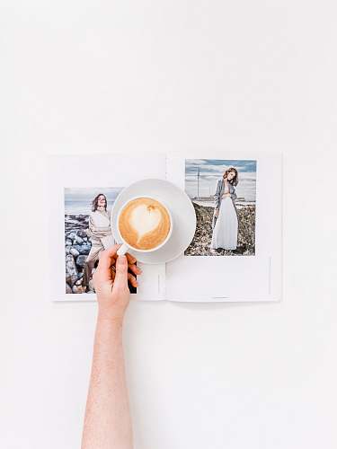art person holding cup of coffee pottery
