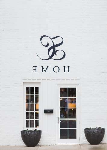 flora Home storefront beside white door jar