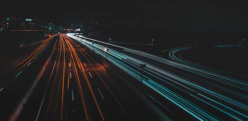 highway time lapse photography of lighted road at night freeway