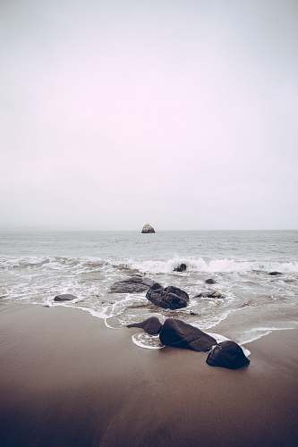 sea rocks on sea side at daytime beach