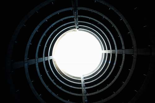 circle low-angle photography of tunnel looking up