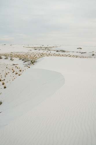dune snowfield during cloudy sky white sands national monument