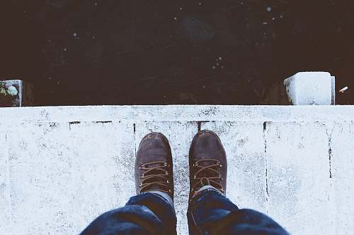 boot person standing white floor ice